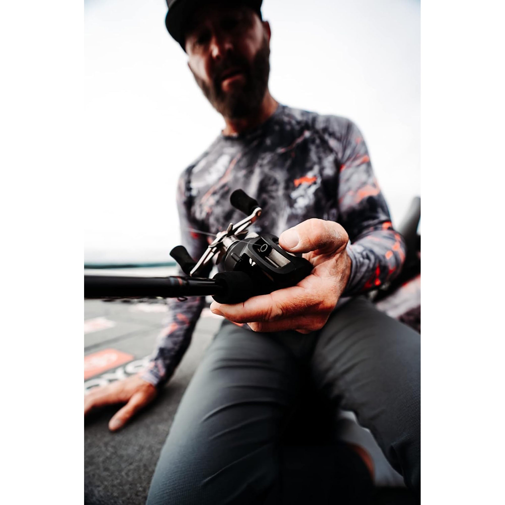 Man holding a fishing rod with a blurred background