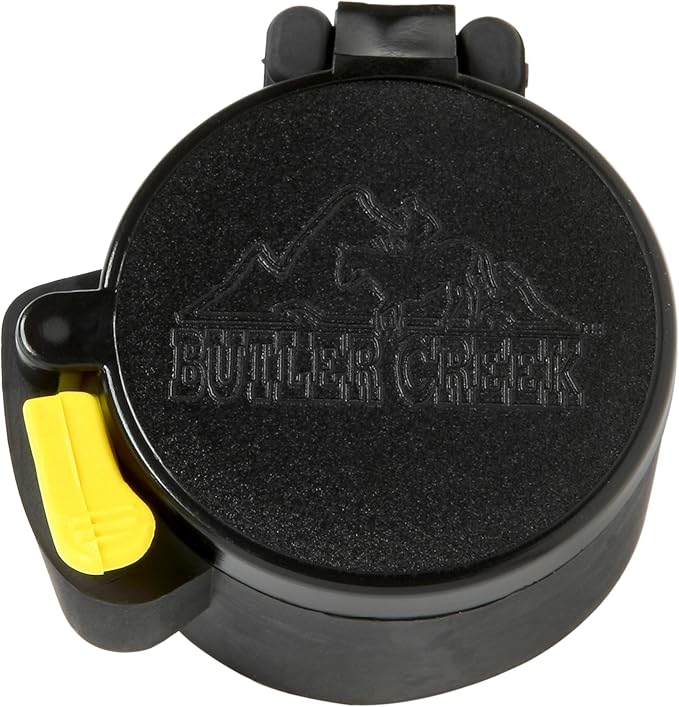 Butler Creek scope cover with yellow release button on a white background