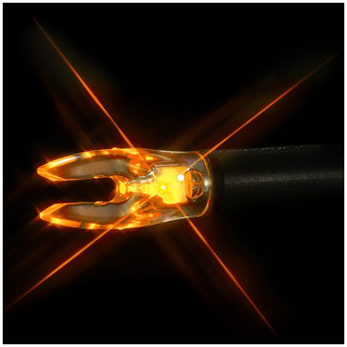 Close-up of a glowing orange lighted nock on a black background