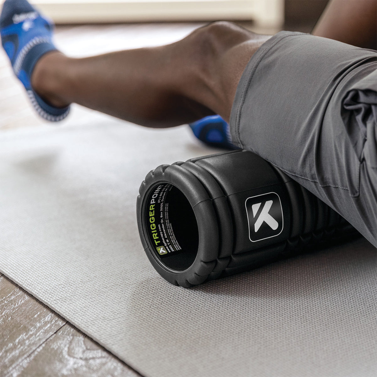 Person using a foam roller myofascial release - Forza Sports