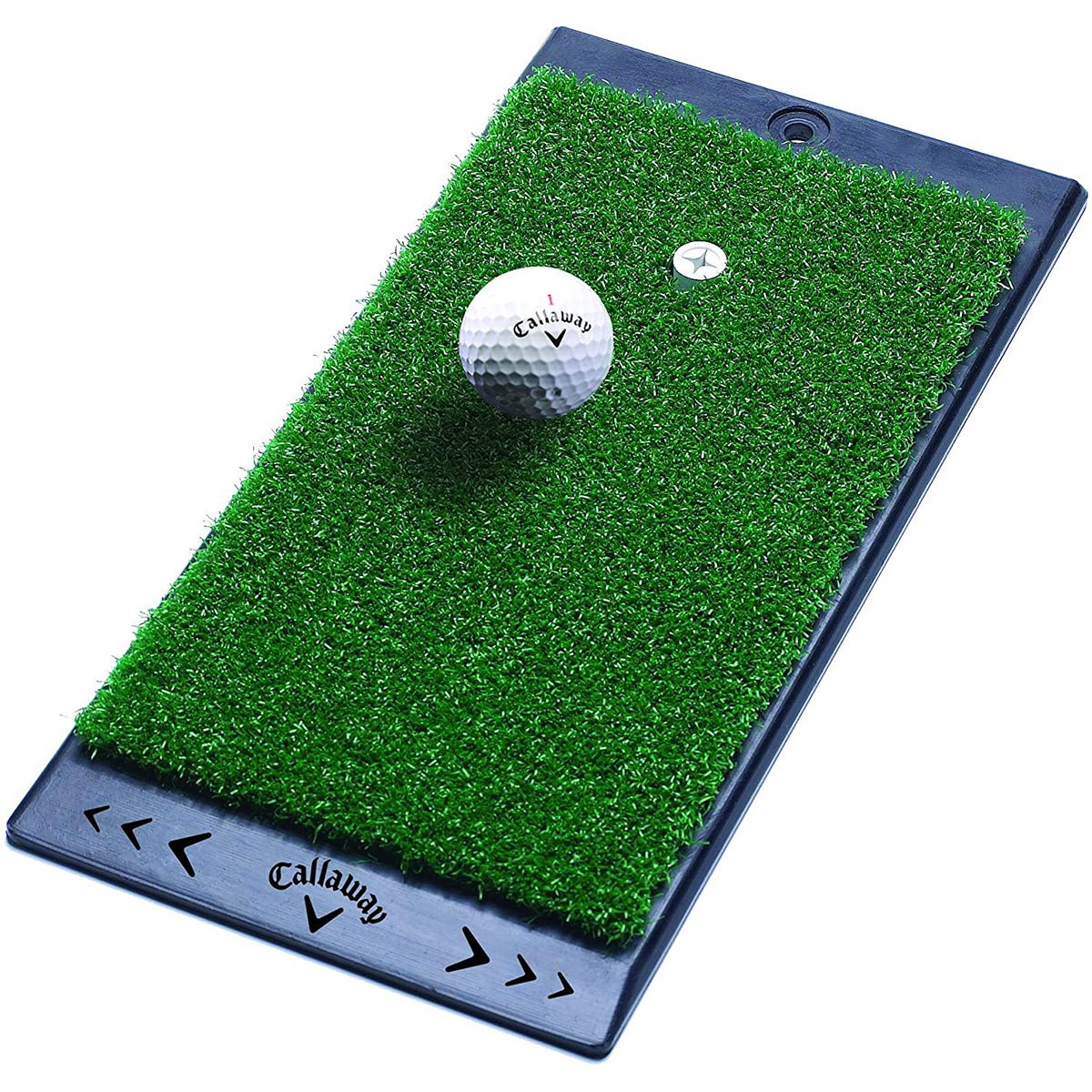 Golf ball on a Callaway golf prac with artificial grass surfaceice set