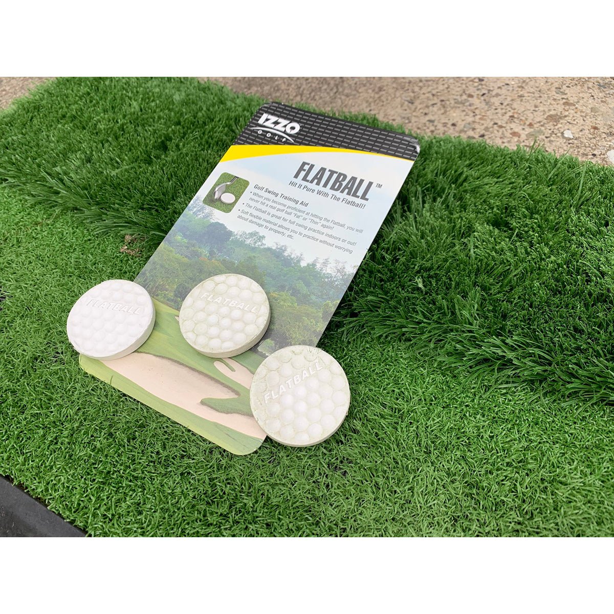 Golf practice flatball training aid and a flatball trainer on a grass-like mat