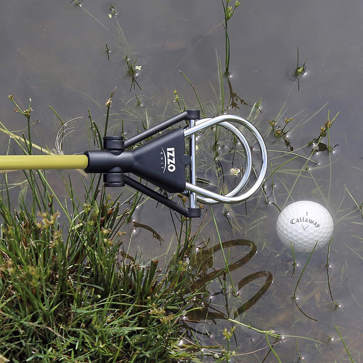 Golf ball retriever in use with a golf ball in water