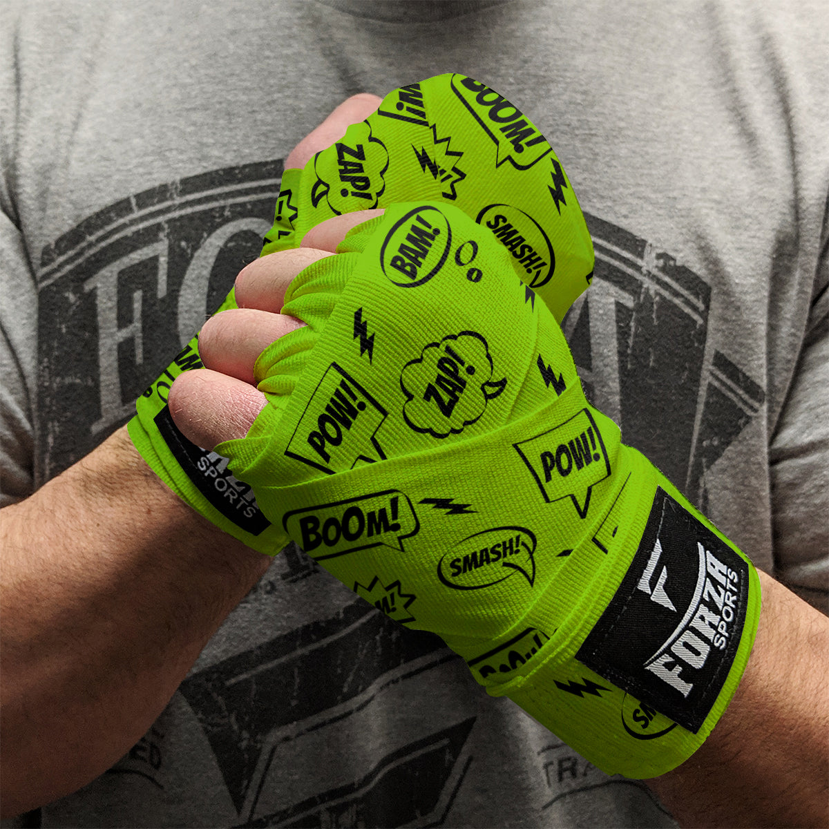 Person wearing bright green boxing wraps with text design, branded 'Forte Sports', against a gray t-shirt background.