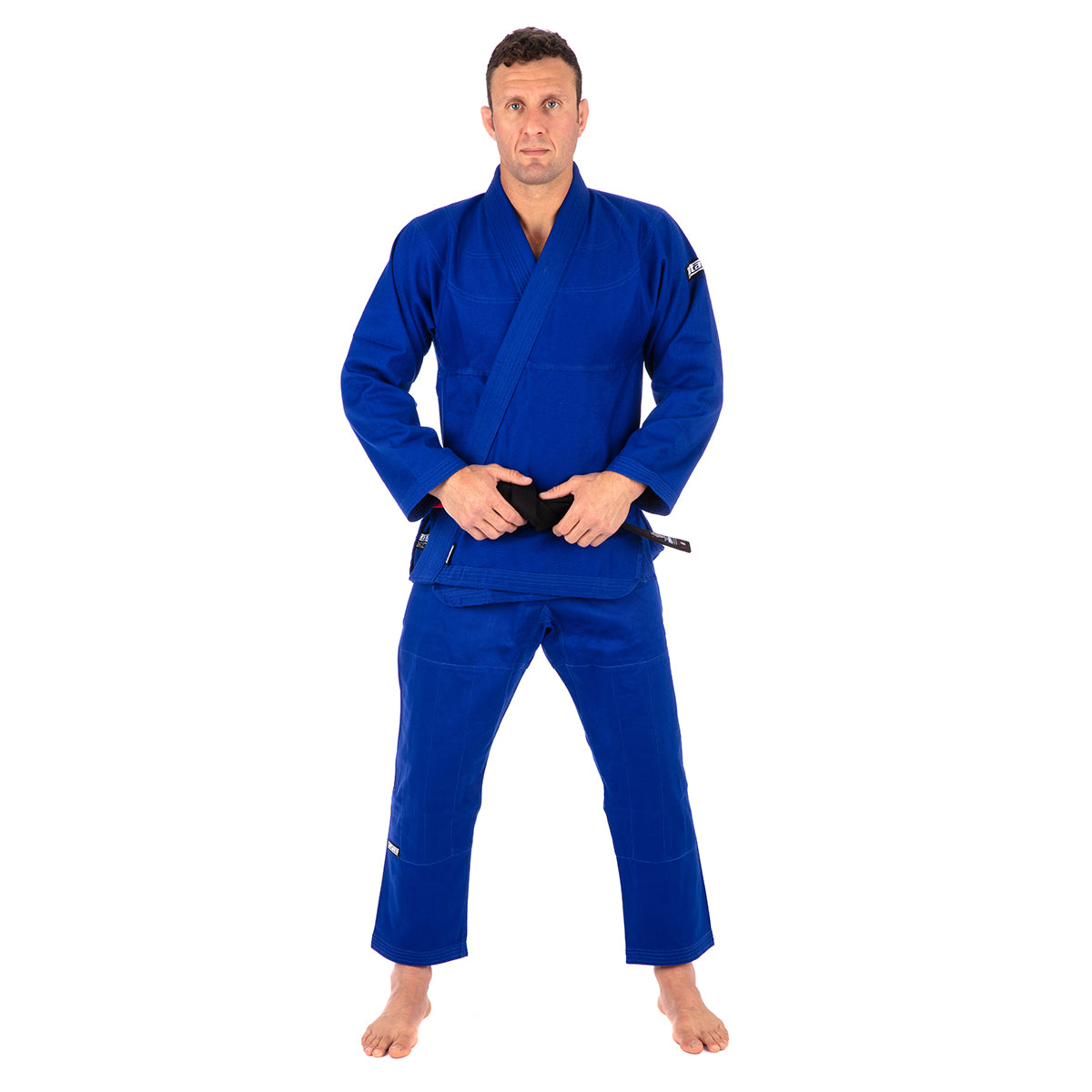 Person wearing a blue martial arts uniform on a white background
