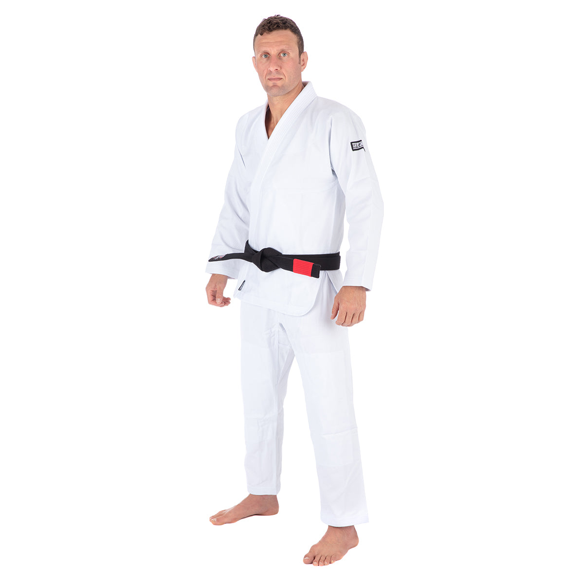 Man wearing a white martial arts uniform with a black belt on a white background