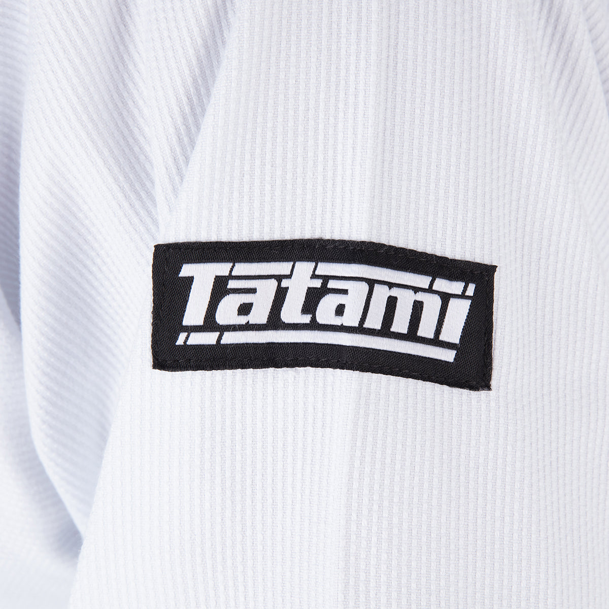 Tatami logo on a white martial arts uniform