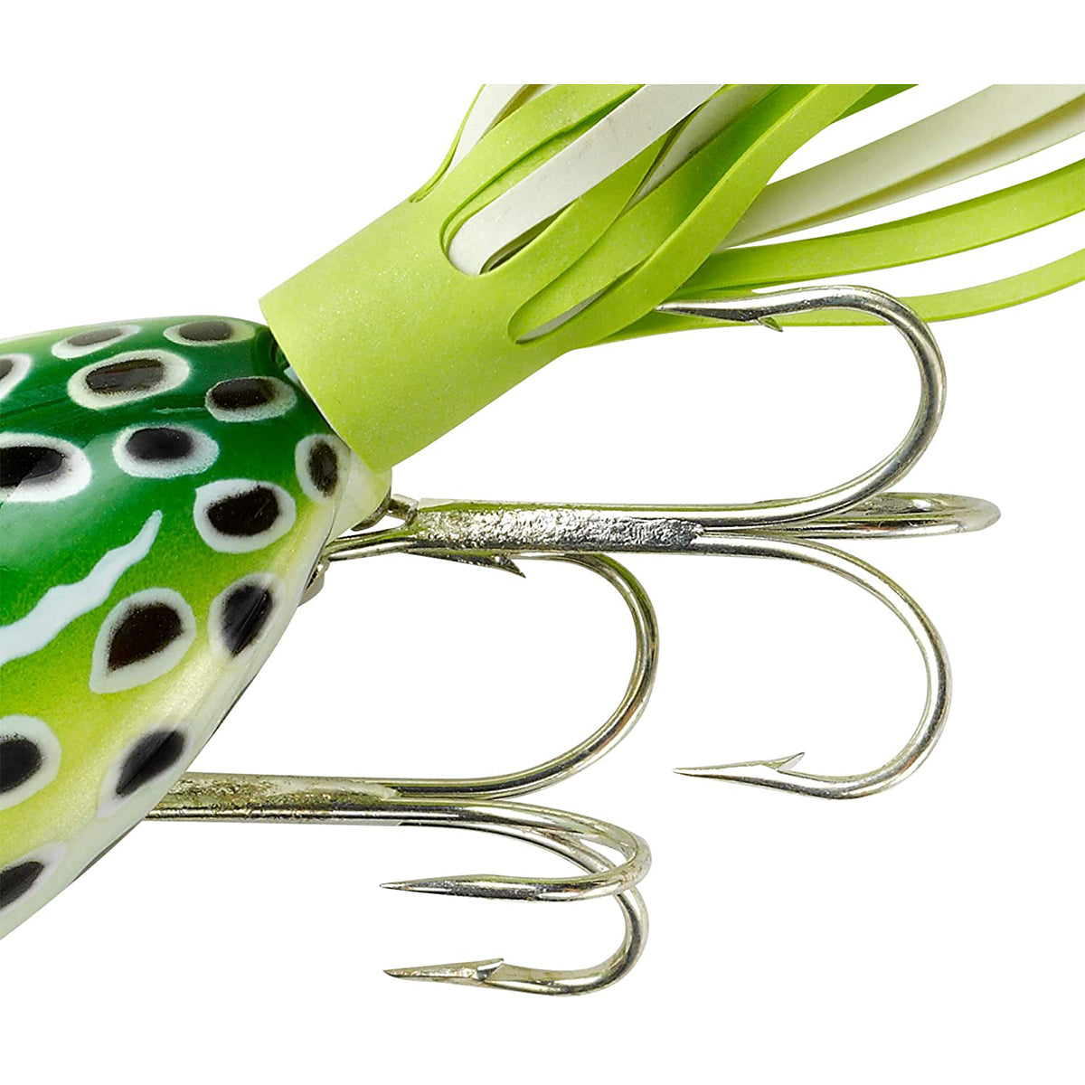 Close-up of a green and black fishing lure with multiple hooks on a white background
