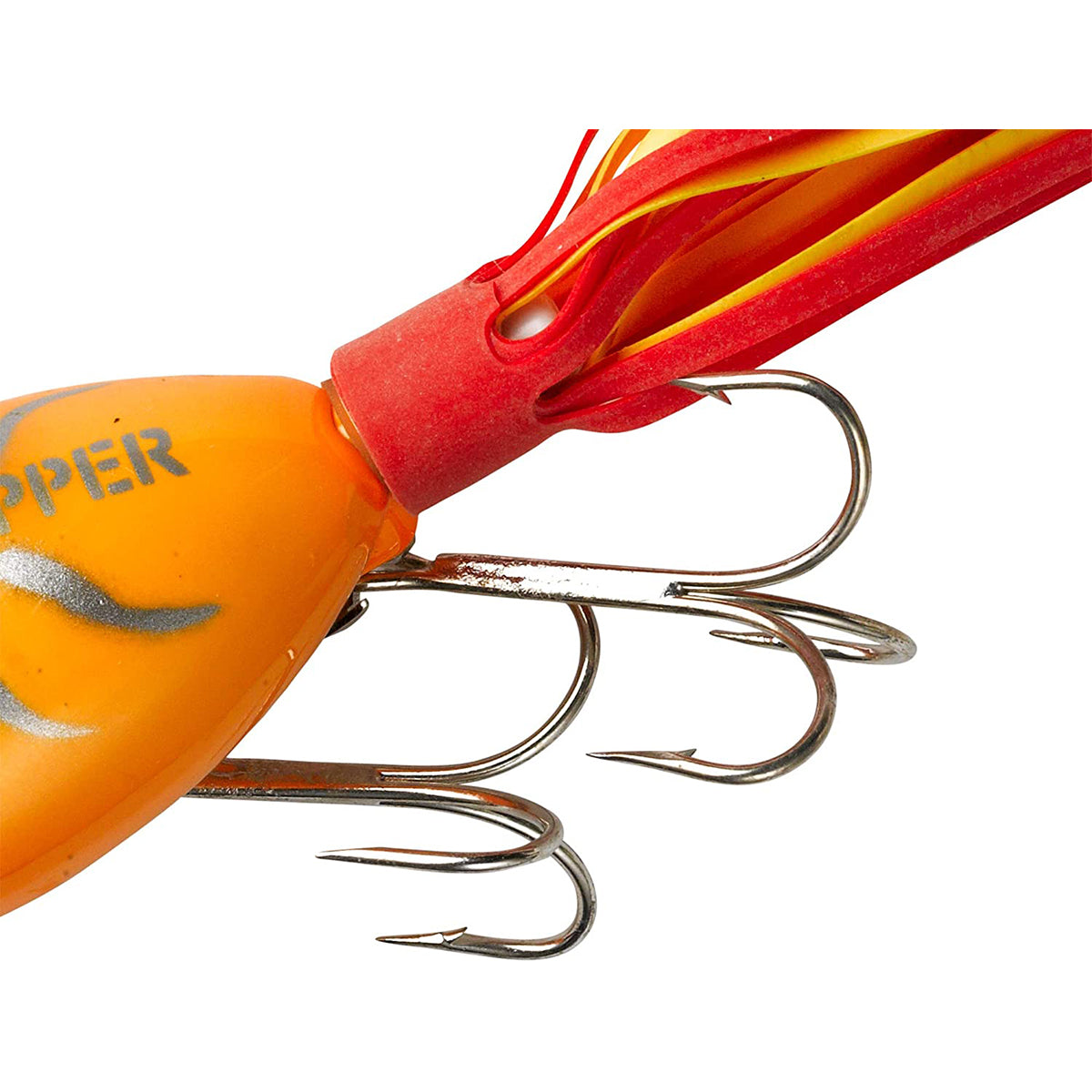 Close-up of a fishing lure with red and yellow skirt on a white background