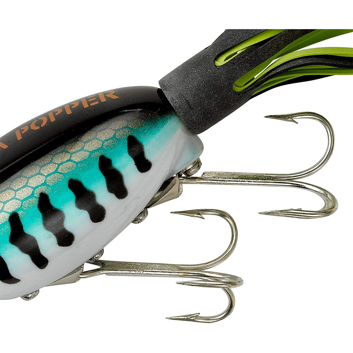 Close-up of a fishing lure with detailed view of hooks and color patterns on a white background