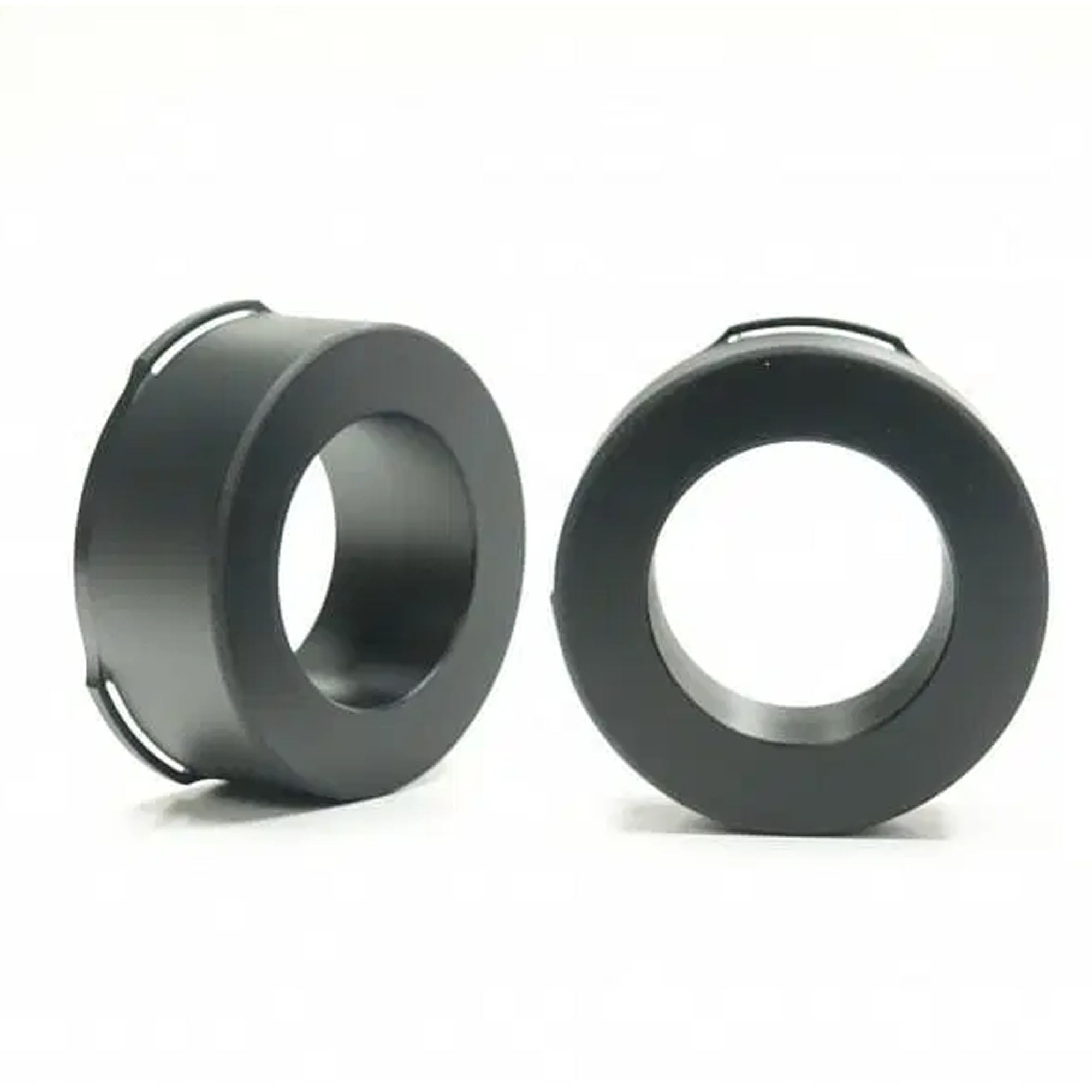 Two black metal washers on a white background