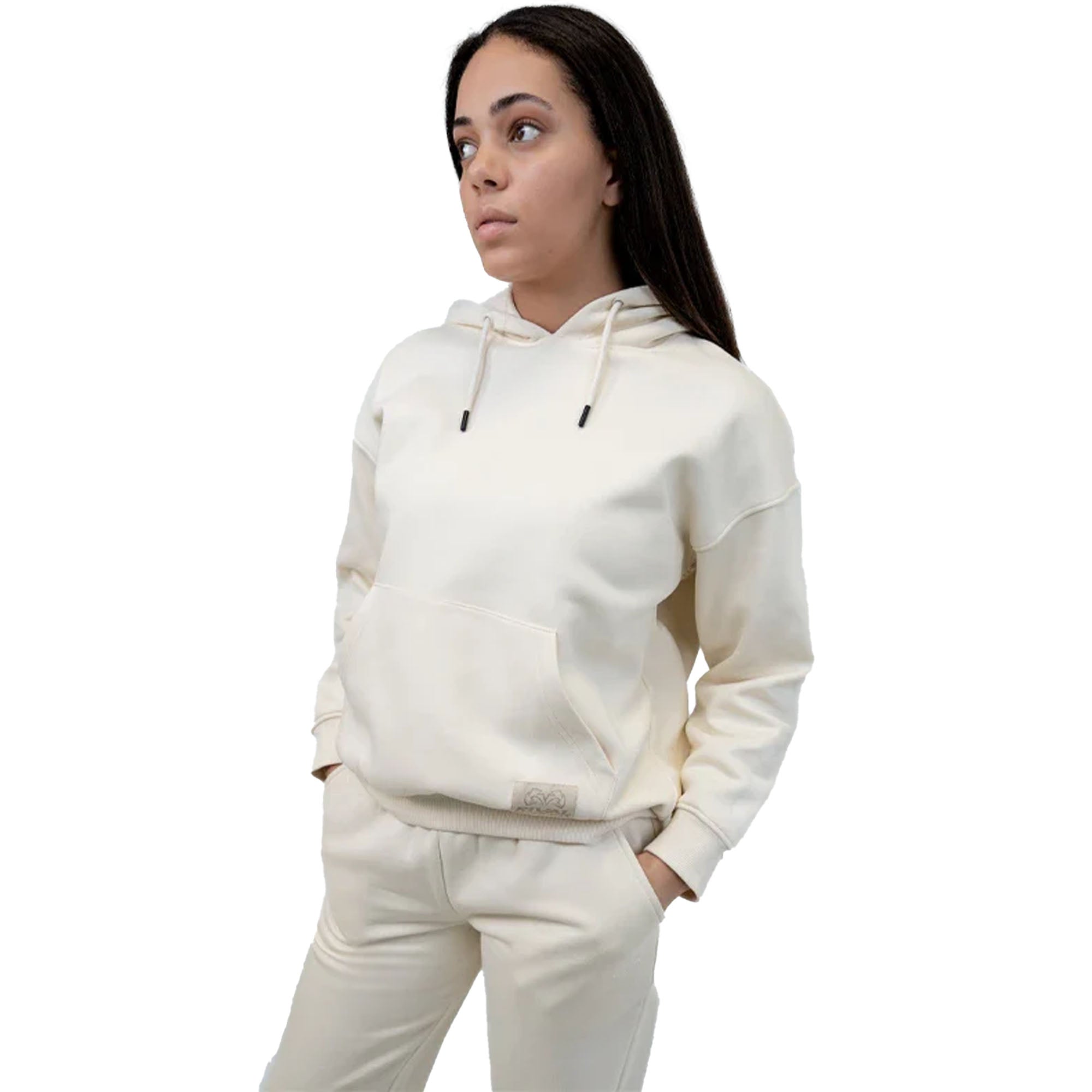Person wearing a white heavyweight fleece hoodie and pants on a white background