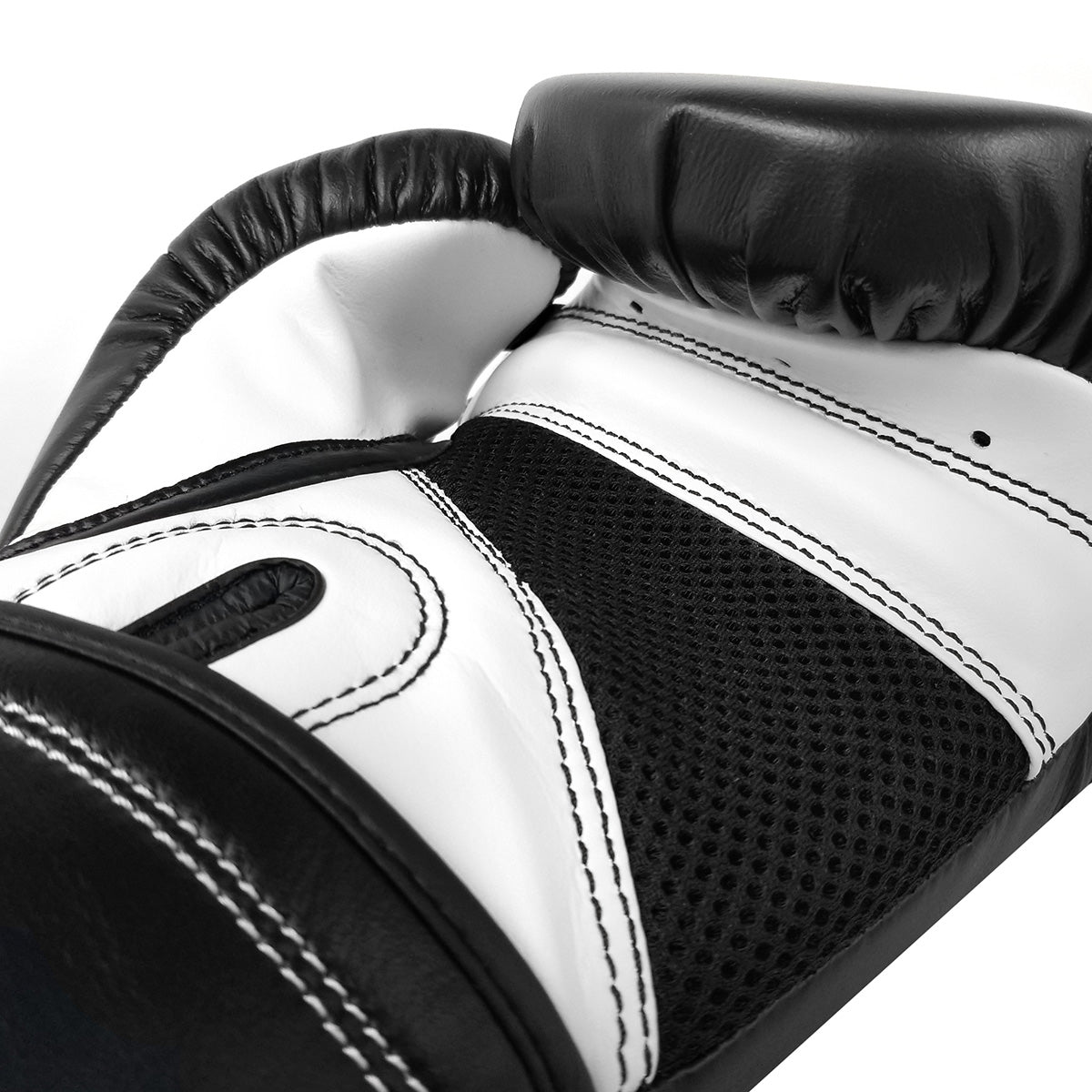 Close-up of a black and white boxing glove on a white background