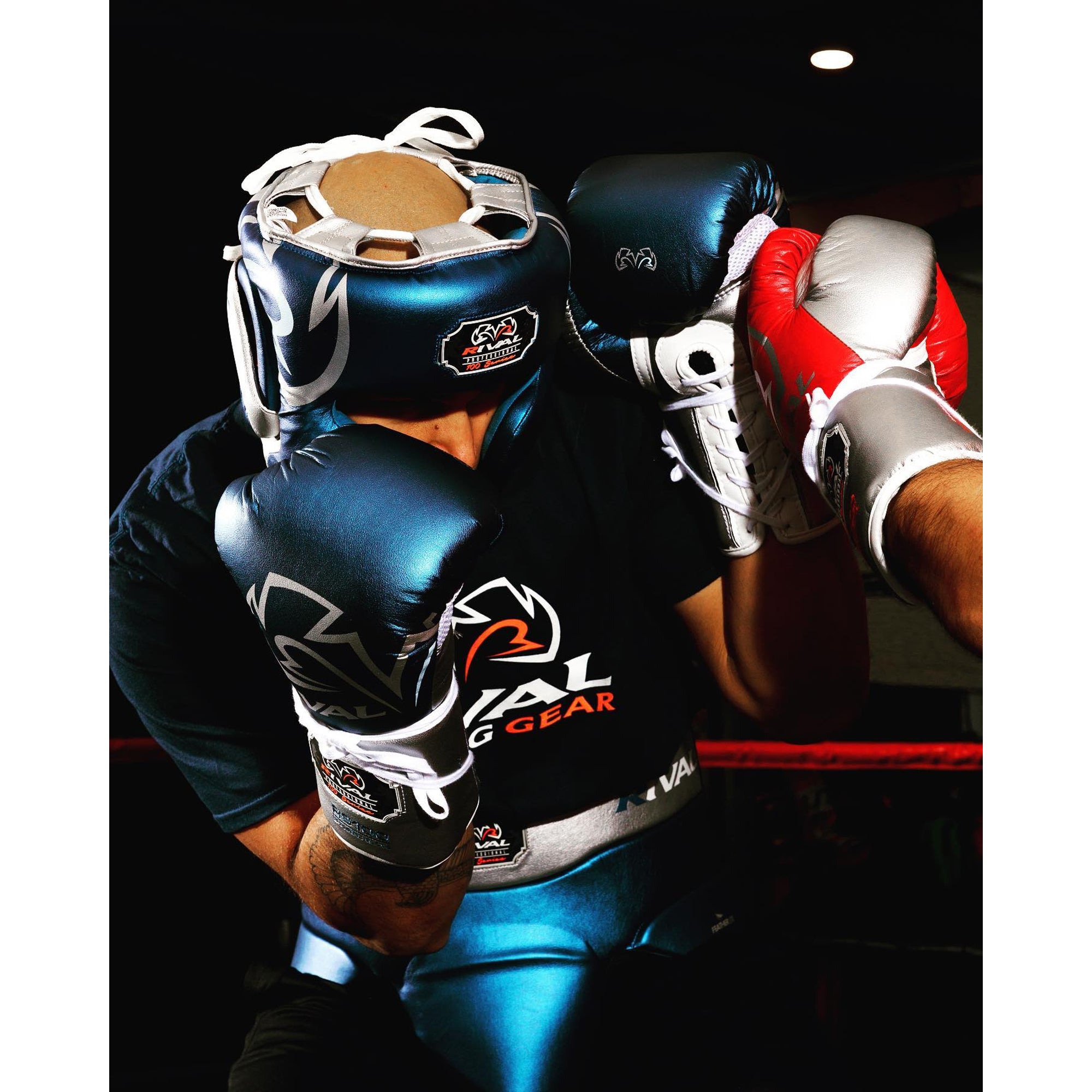 Person wearing boxing gear with visible brand logos on a dark background