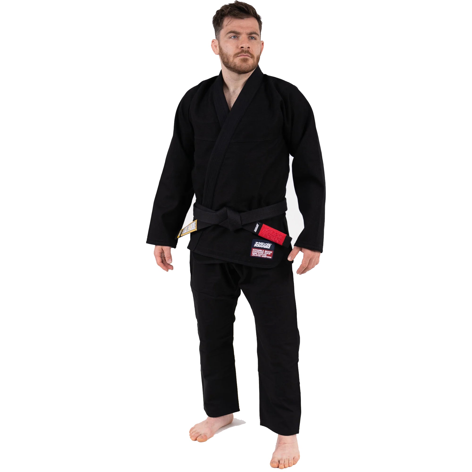 Man wearing a black martial arts uniform on a white background