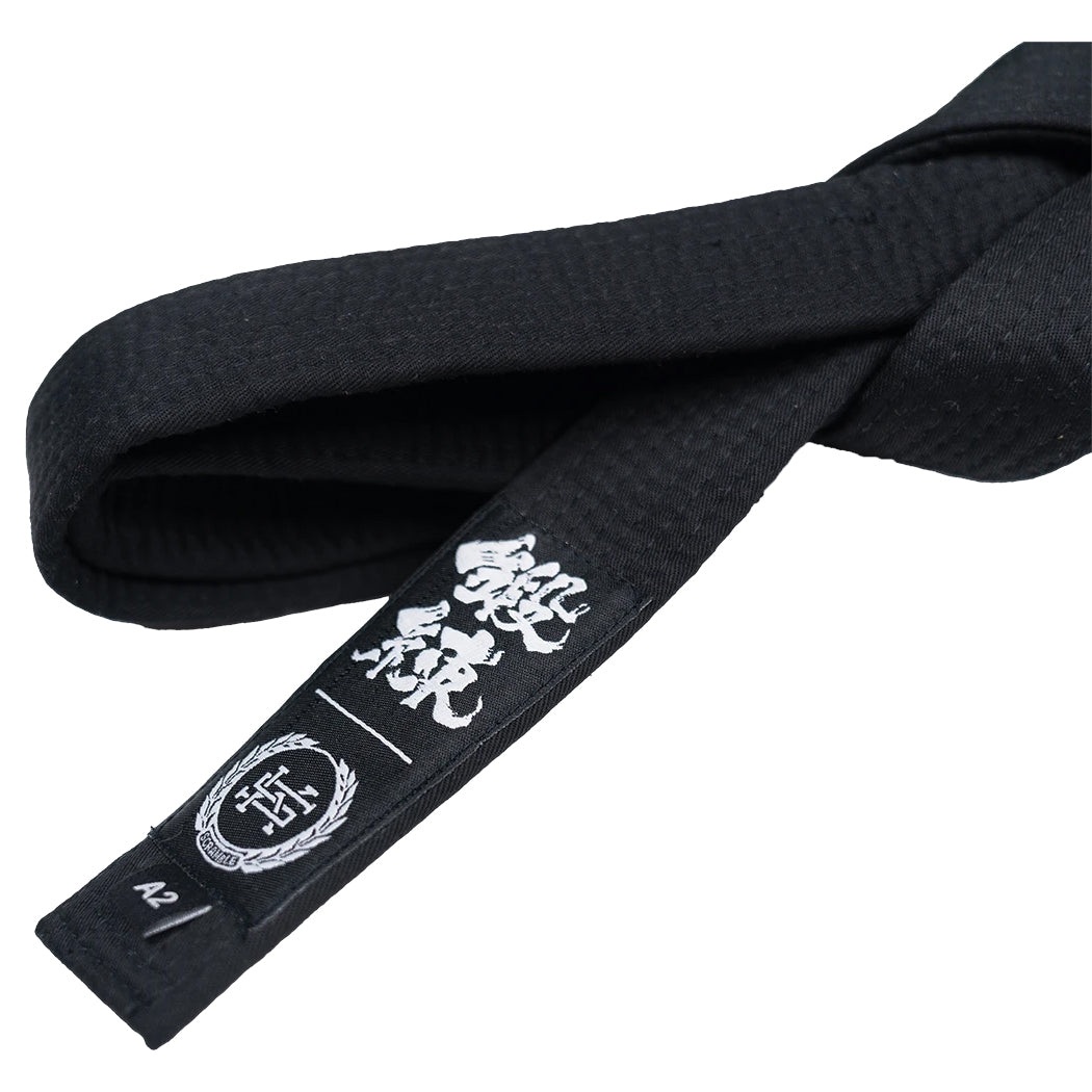 Black martial arts belt with white emblem and text on a white background