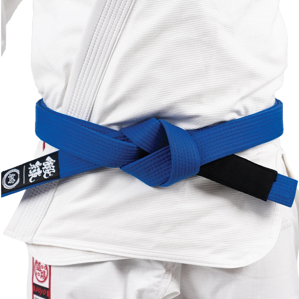 White martial arts uniform with a blue belt on a white background