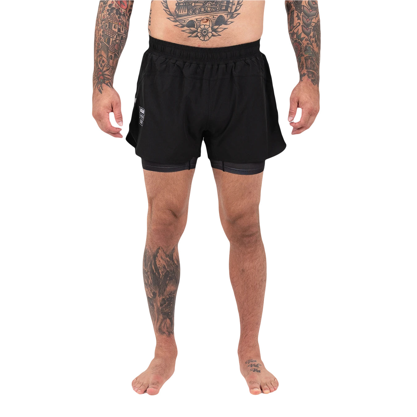 Person wearing black athletic shorts on a white background