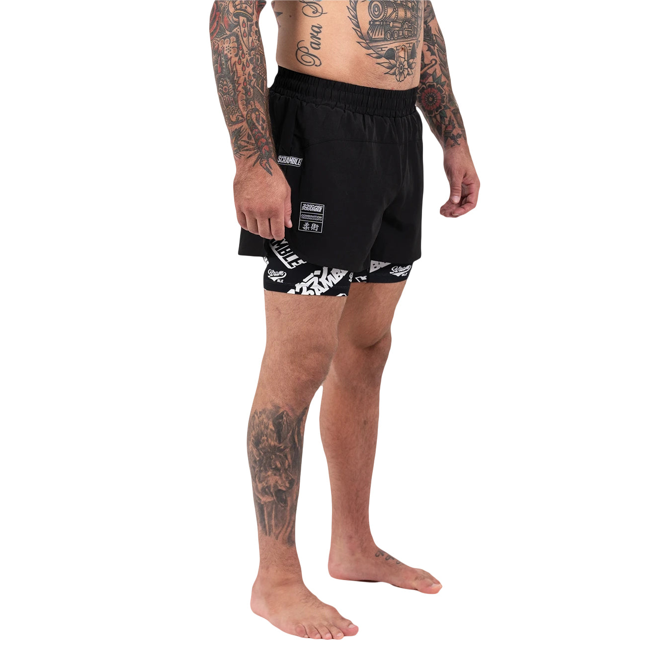 Person wearing black shorts with white patterns on a white background