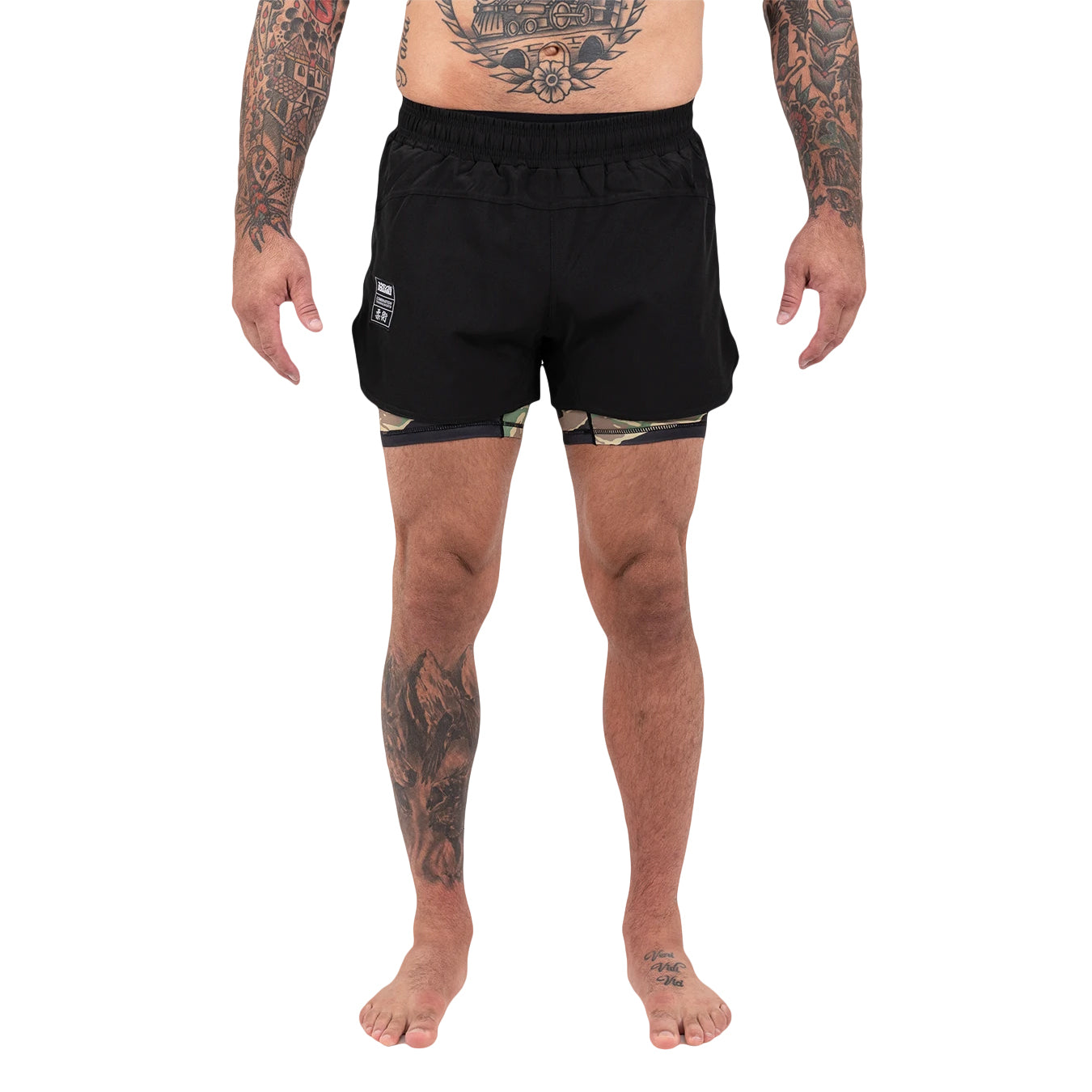 Person wearing black athletic shorts on a white background