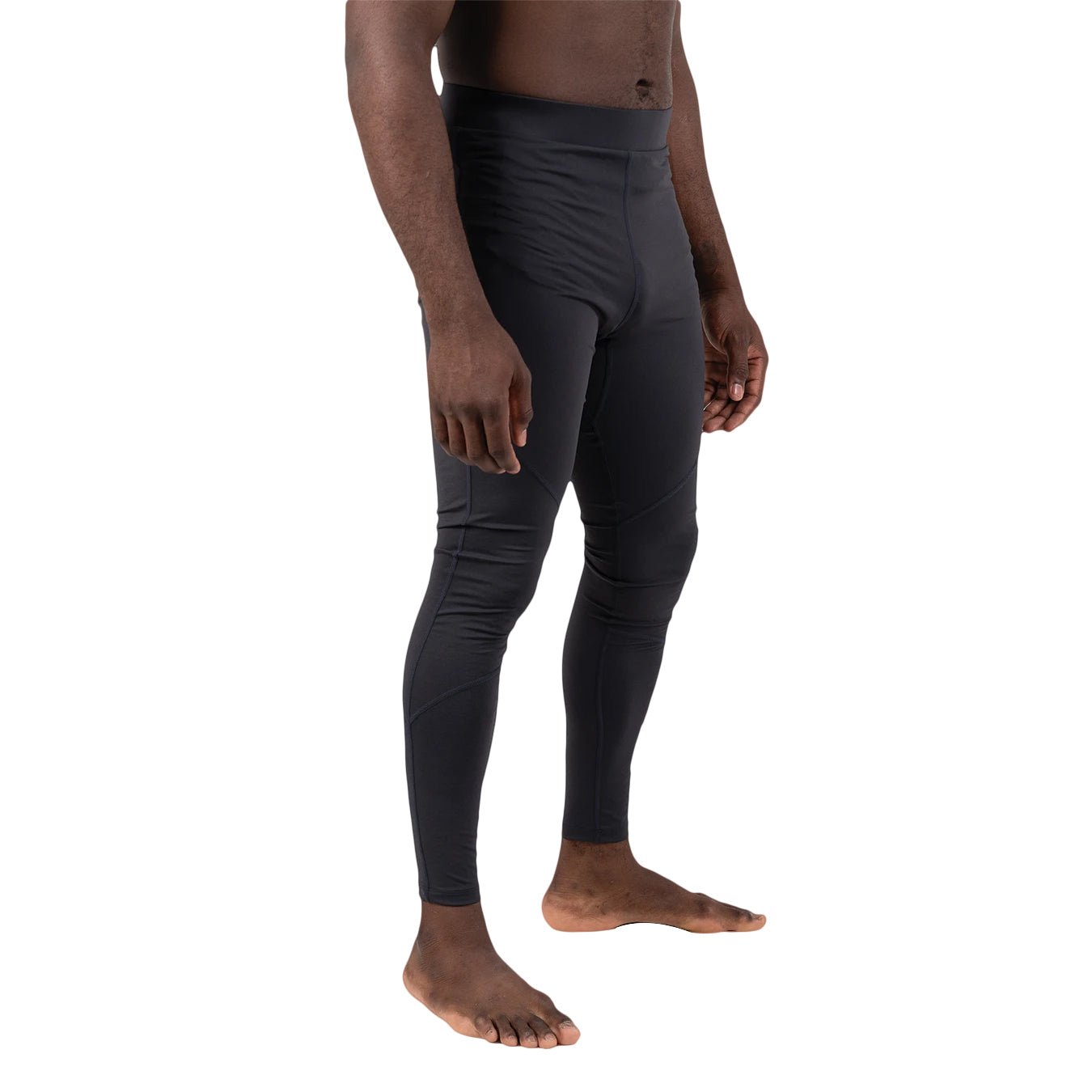 Person wearing black compression leggings on a white background