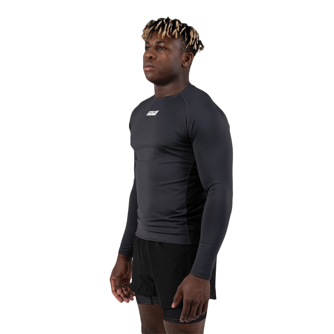 Person wearing a black long-sleeve athletic shirt on a white background