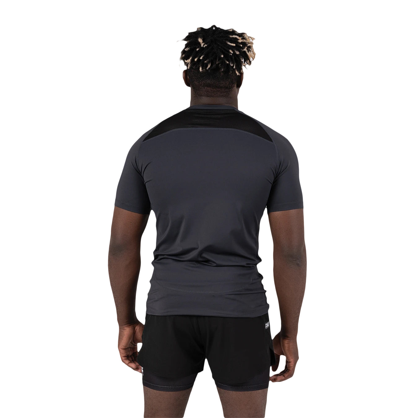 Person wearing a black sports outfit on a white background