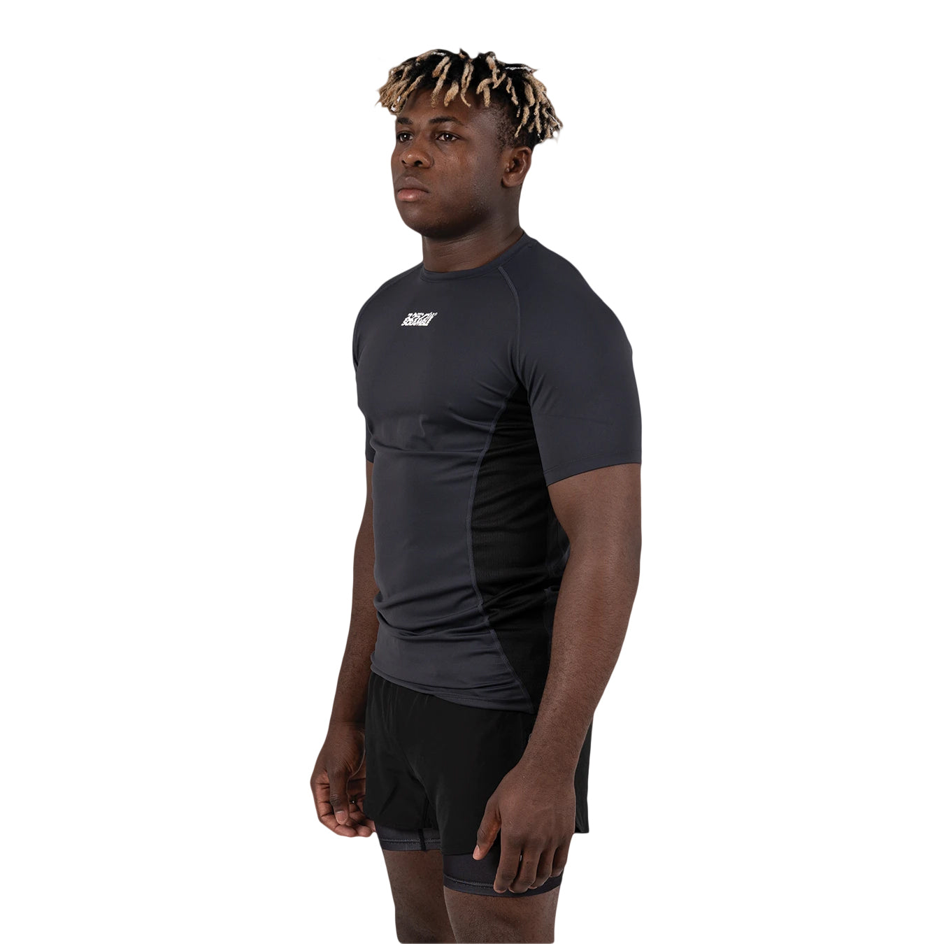 Person wearing a black athletic outfit with a visible brand logo on a white background