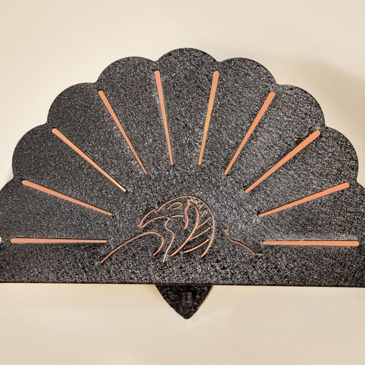 Decorative stone wall art with shell design turkey hooker and central emblem on a beige background