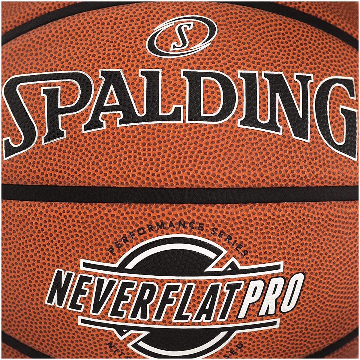 Spalding Neverflat Pro basketball with visible branding on a brown background