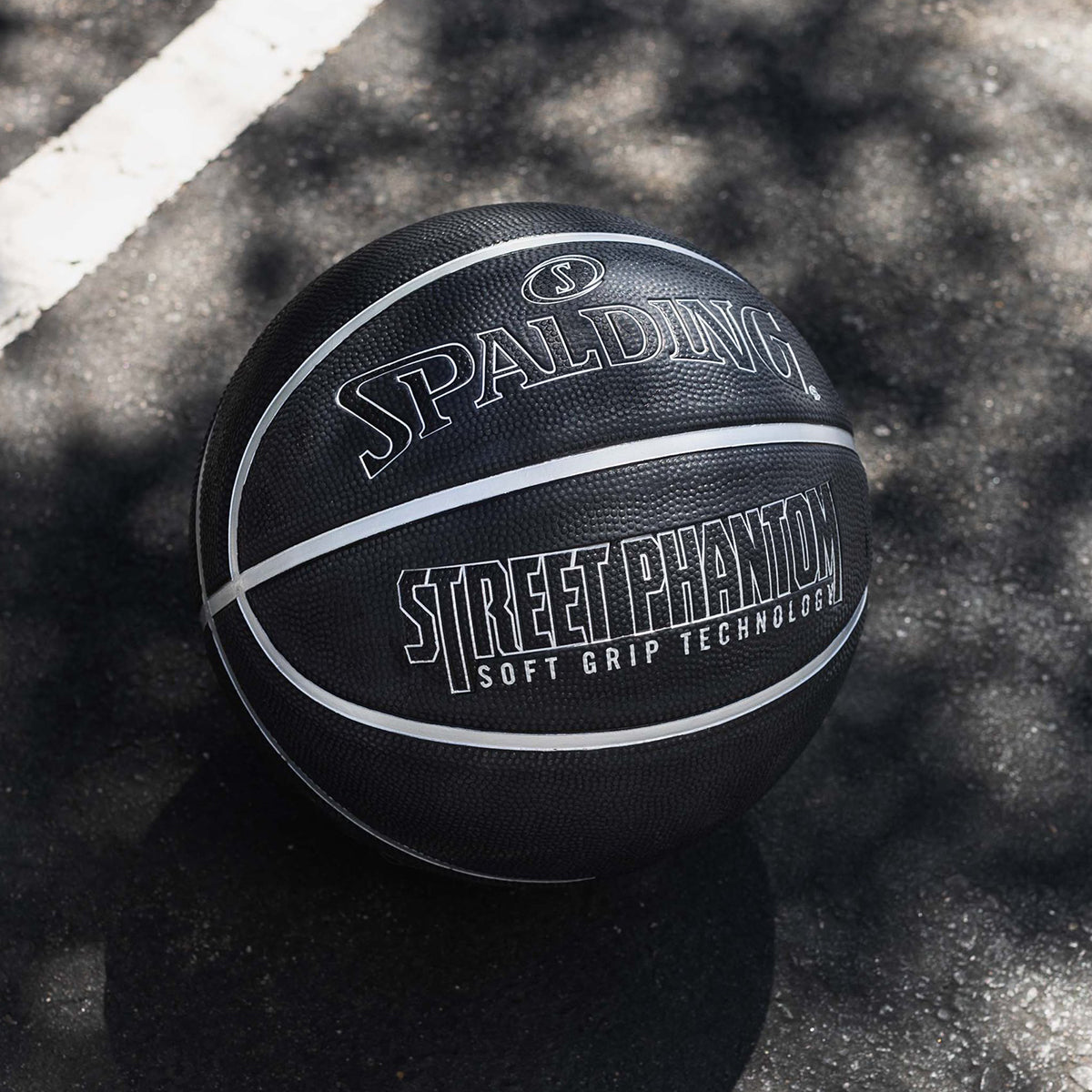 Black Spalding Street Phantom basketball on a textured surface