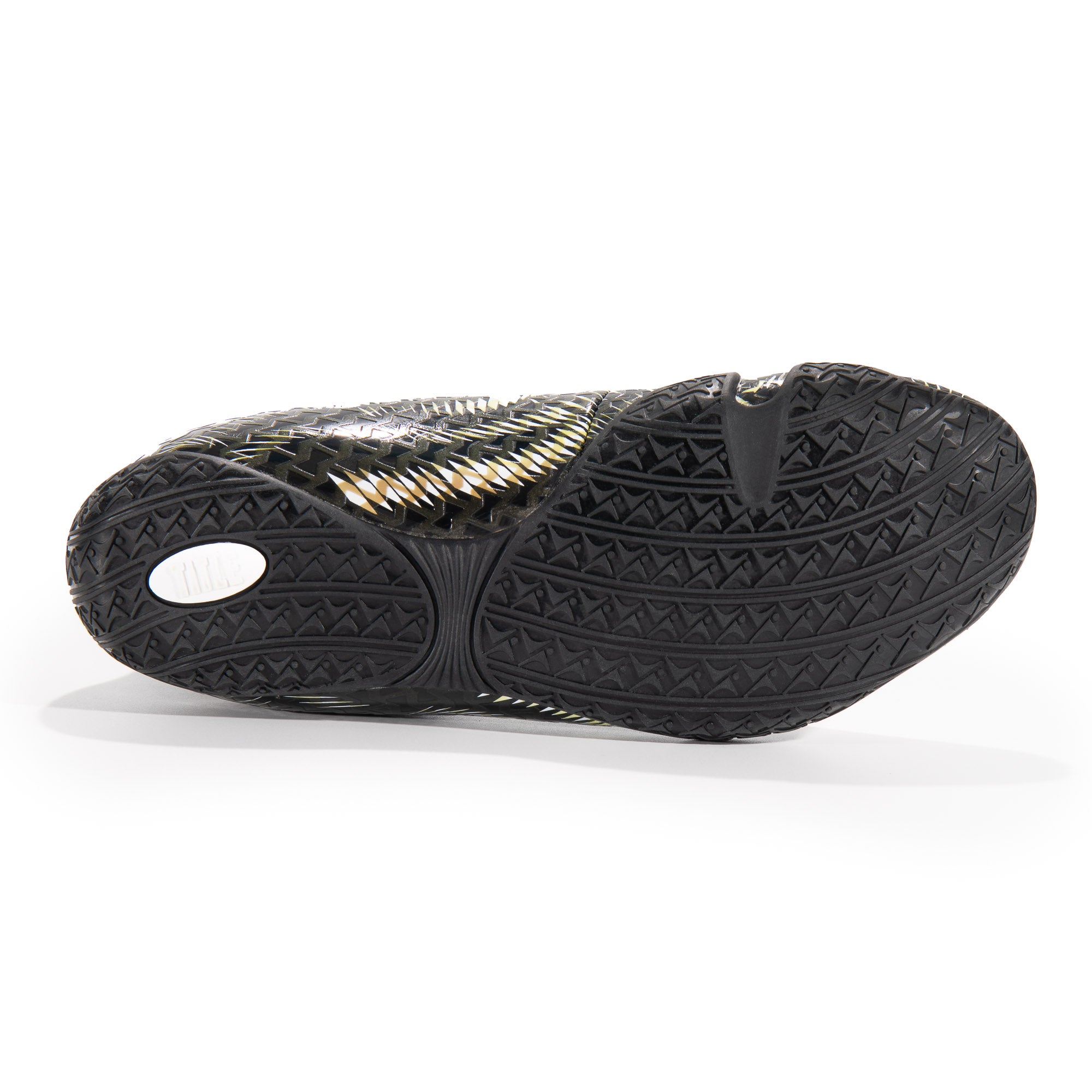 Black shoe sole with textured pattern on a white background