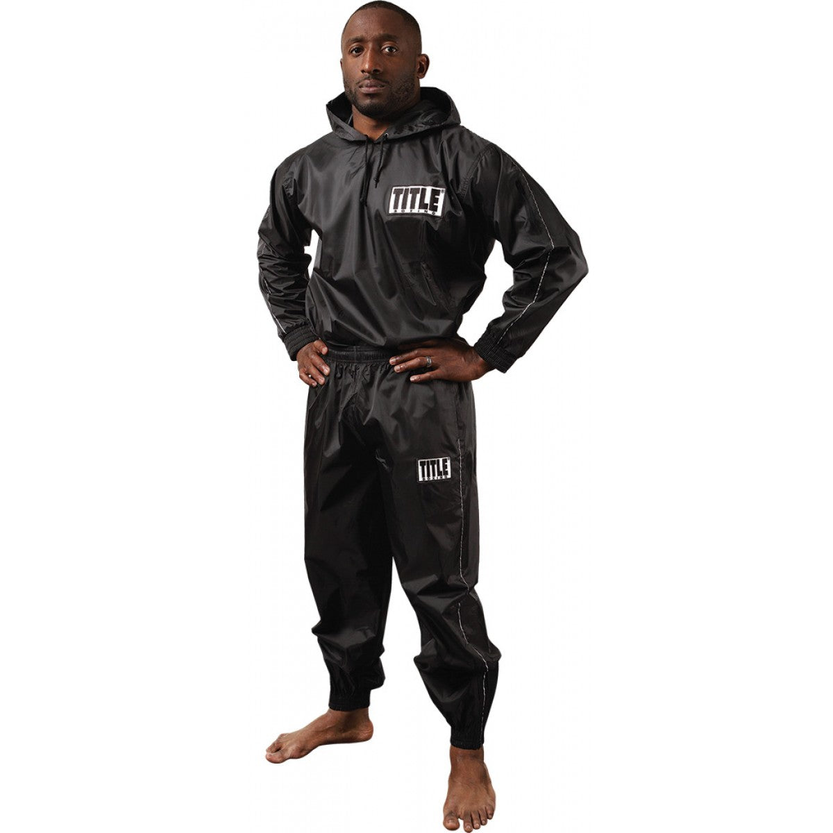Person wearing a black 'Title' tracksuit on a white background - Forza Sports