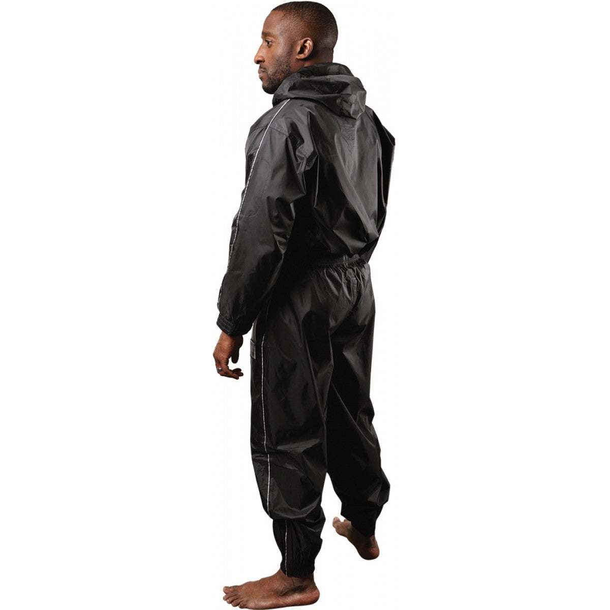 Person wearing a black rain suit on a white background
