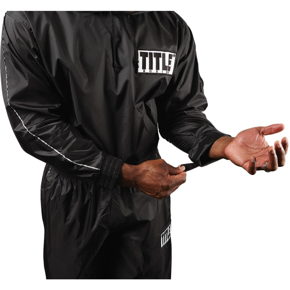 Black TITLE branded jacket worn by a person on a white background