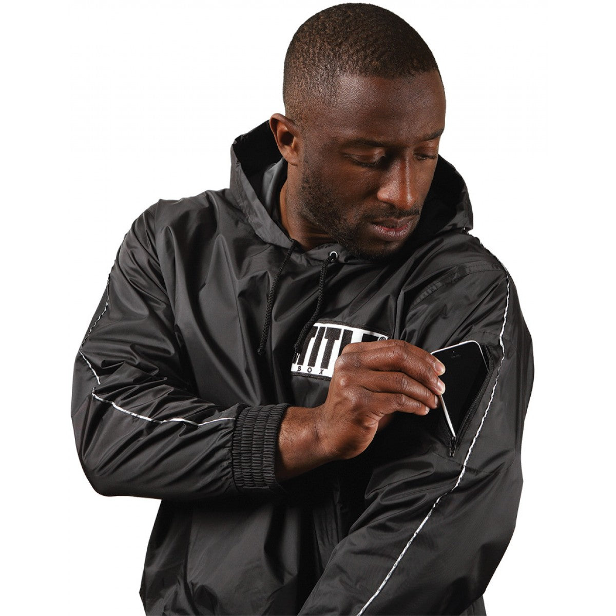 Man wearing a black jacket with a brand logo on a white background