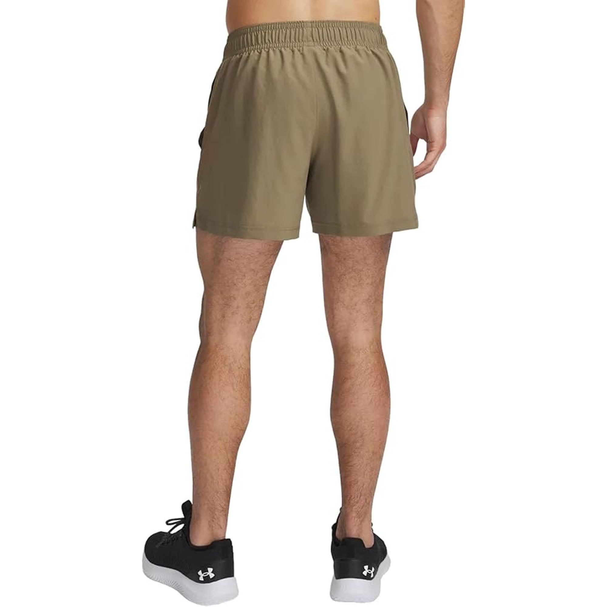 Person wearing khaki woven shorts on a white background