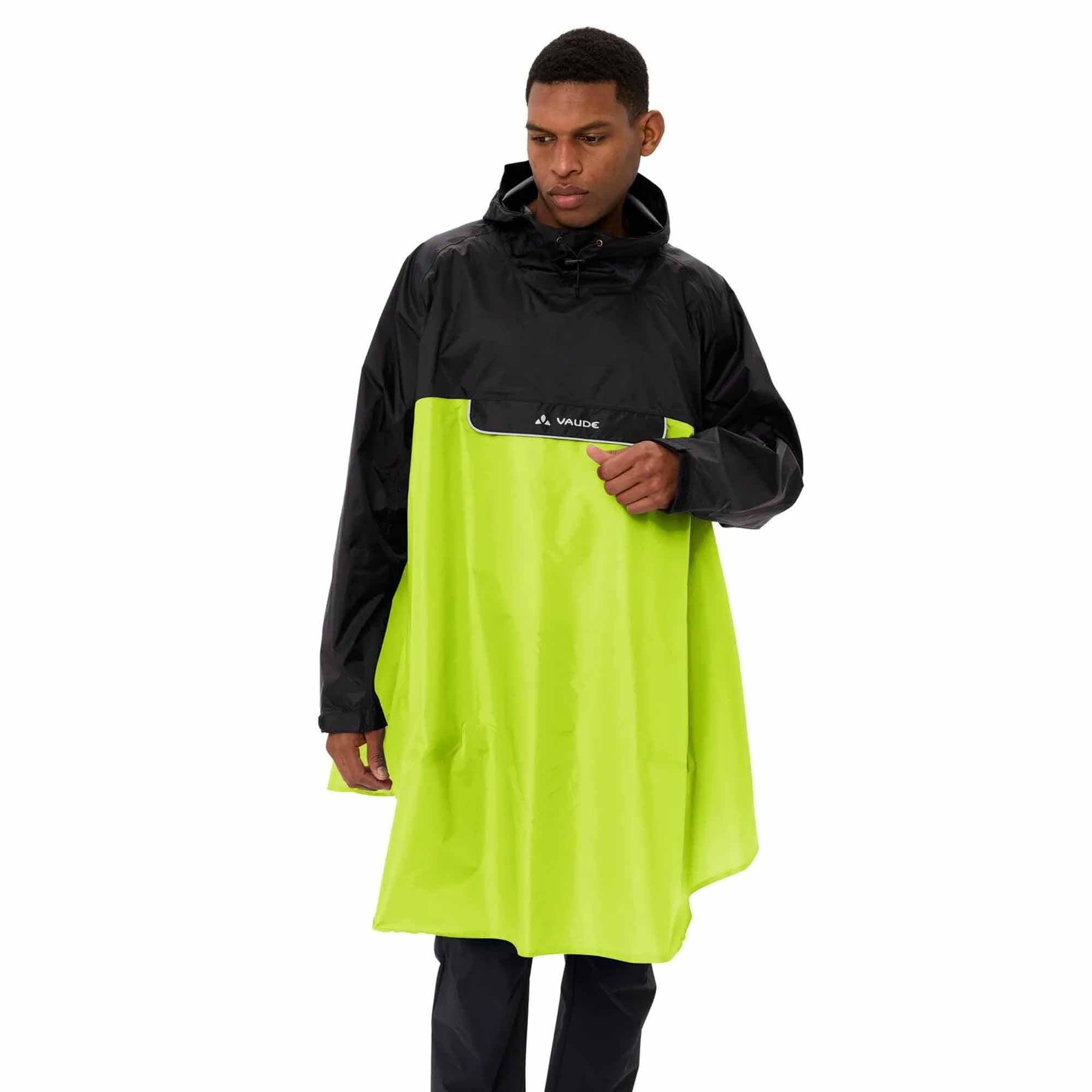 Person wearing a black and yellow biking rain poncho on a white background