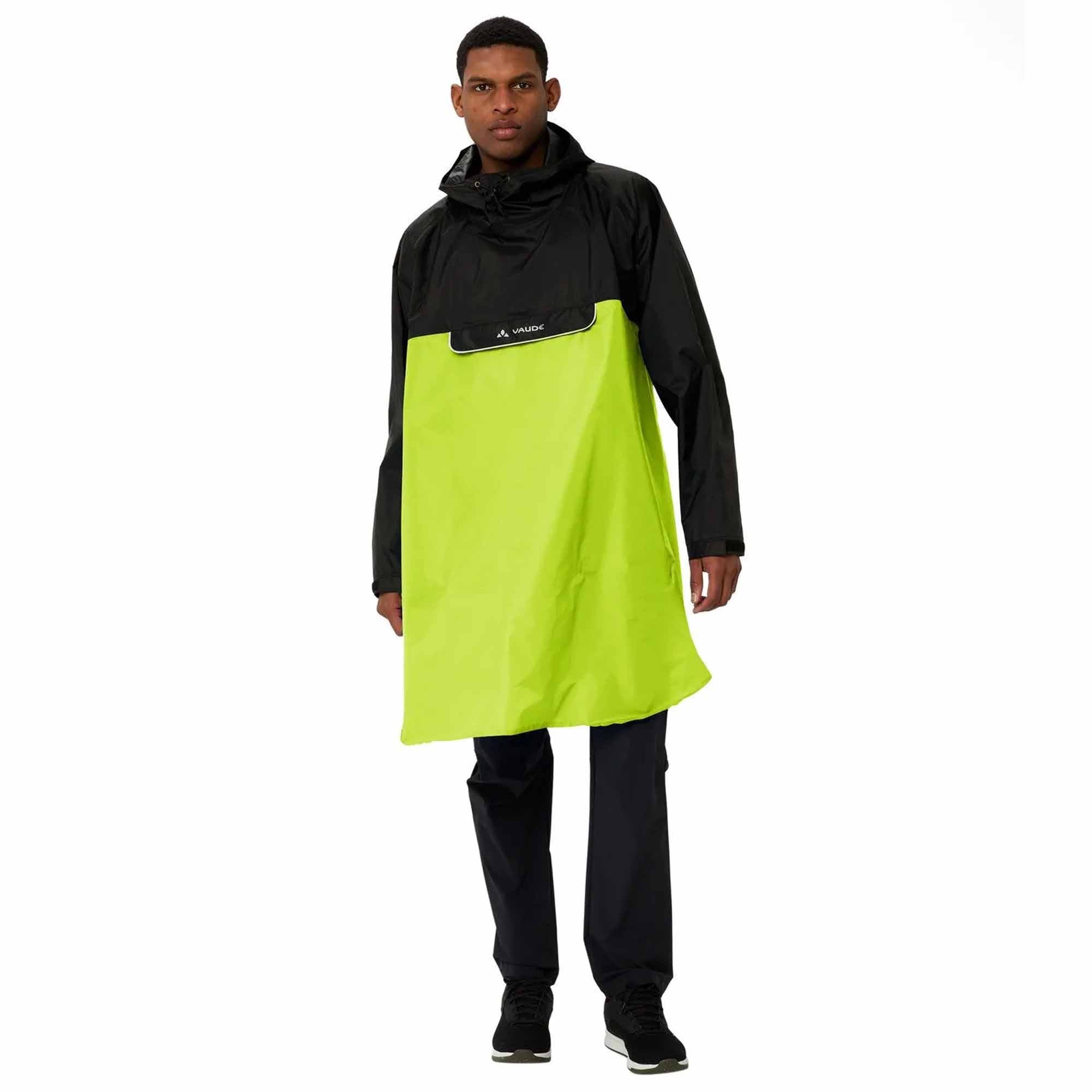 Person wearing a black and green biking rain poncho on a white background