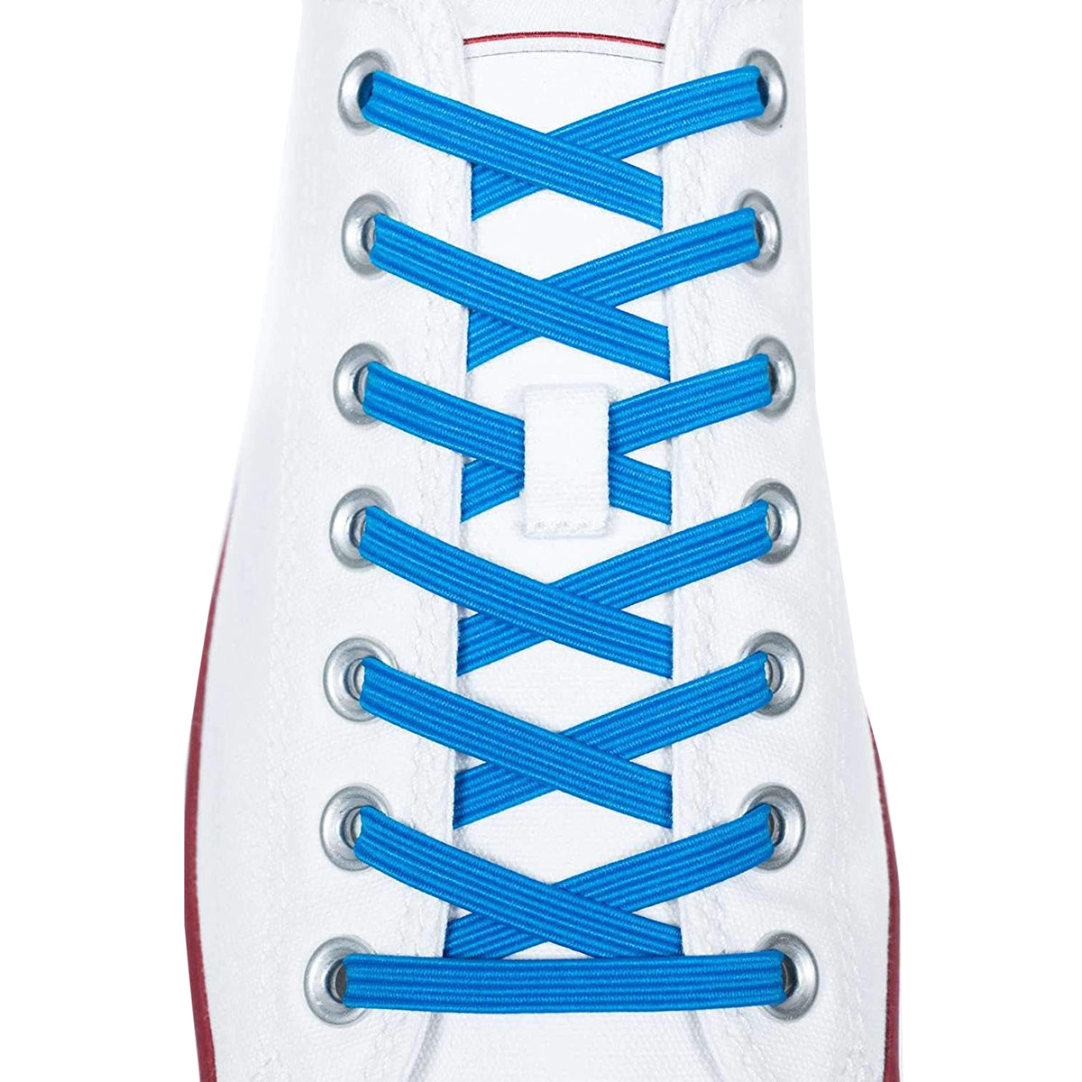 Blue shoelaces on a white sneaker with a red sole.