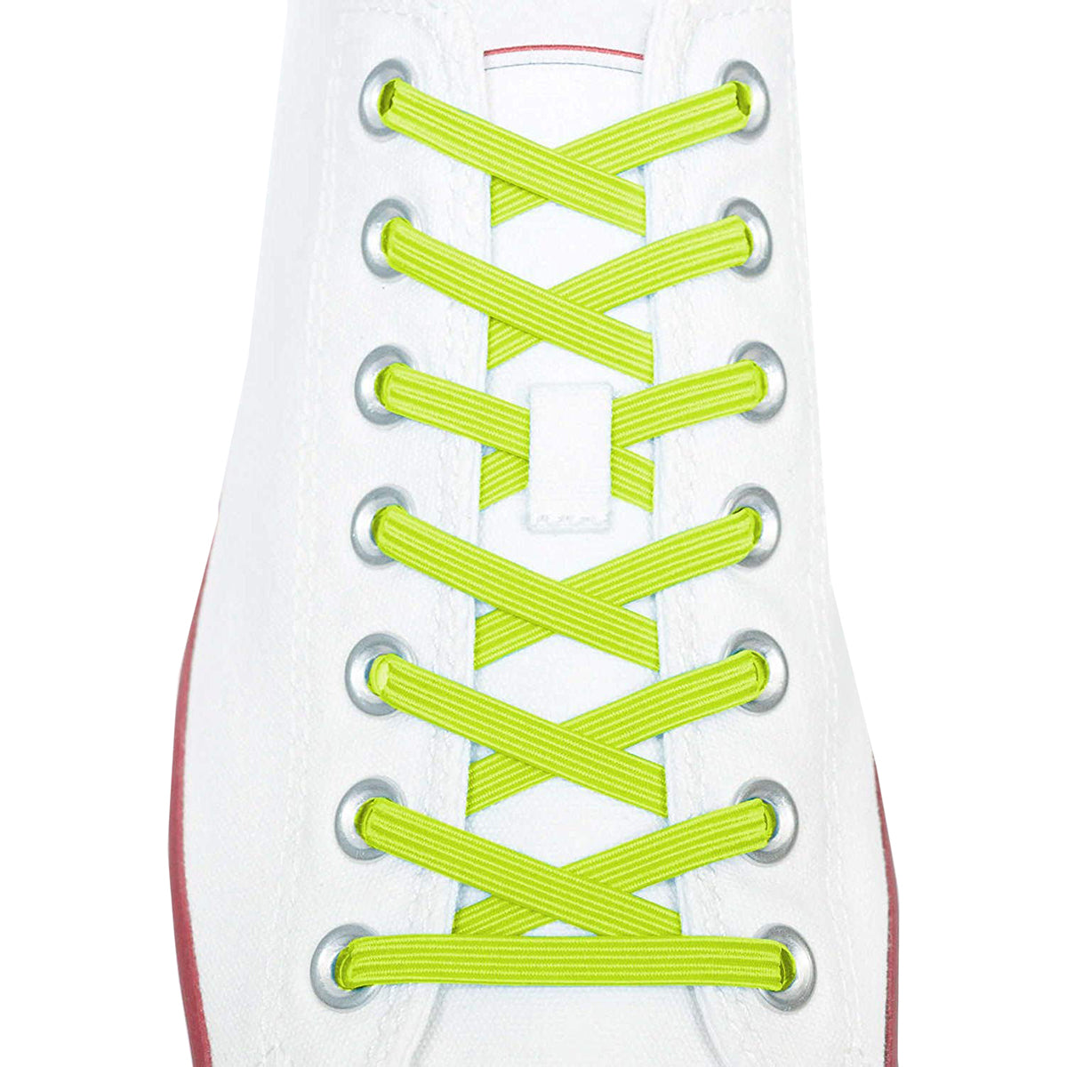 Close-up of a white sneaker with bright green shoelaces on a white background