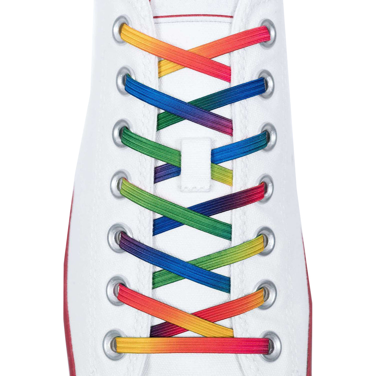 Close-up of a white sneaker with rainbow-colored laces on a white background